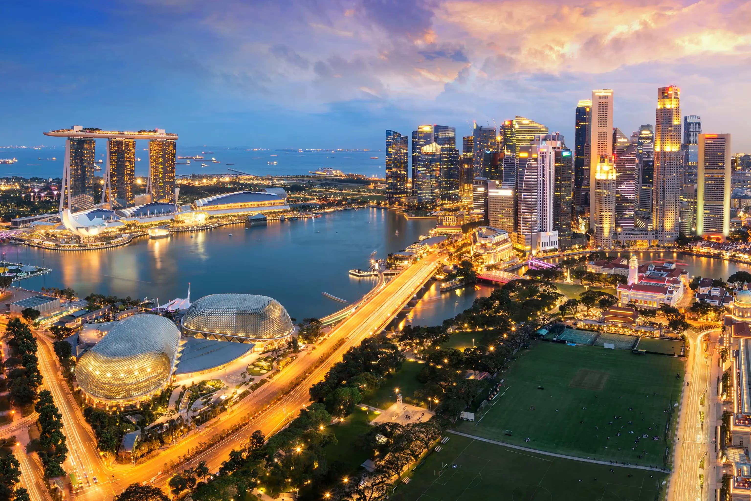 Skyline of Singapore with Marina Bay Sands and Gardens by the Bay.