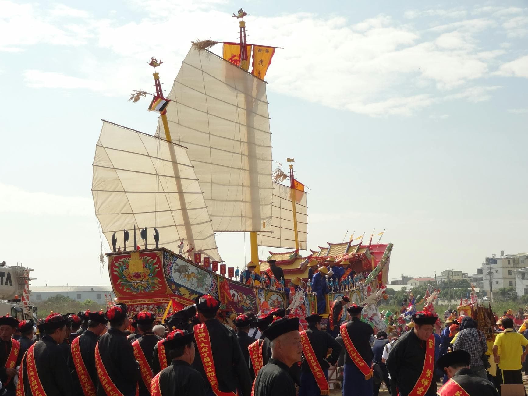 traditional festival with ornate dragon boat display